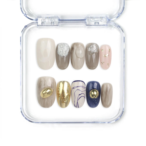 Naillover Eclipse Core handmade Singapore press on nails with neutral tones, gold accents, marbled designs, and shimmering glitter finish.