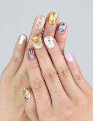 Wearing Naillover Ethereal Shimmer press on nails—short Y2K nails with chrome, butterflies, and plaid accents.