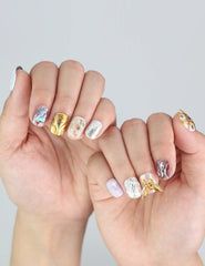 Model hand showing Ethereal Shimmer Singapore press on nails—vibrant, cute short nails with shimmer and texture.