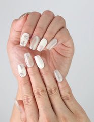 Side view of Flora Sheen Singapore press on nails worn on fingers, highlighting soft pastel blooms and handmade elegance.