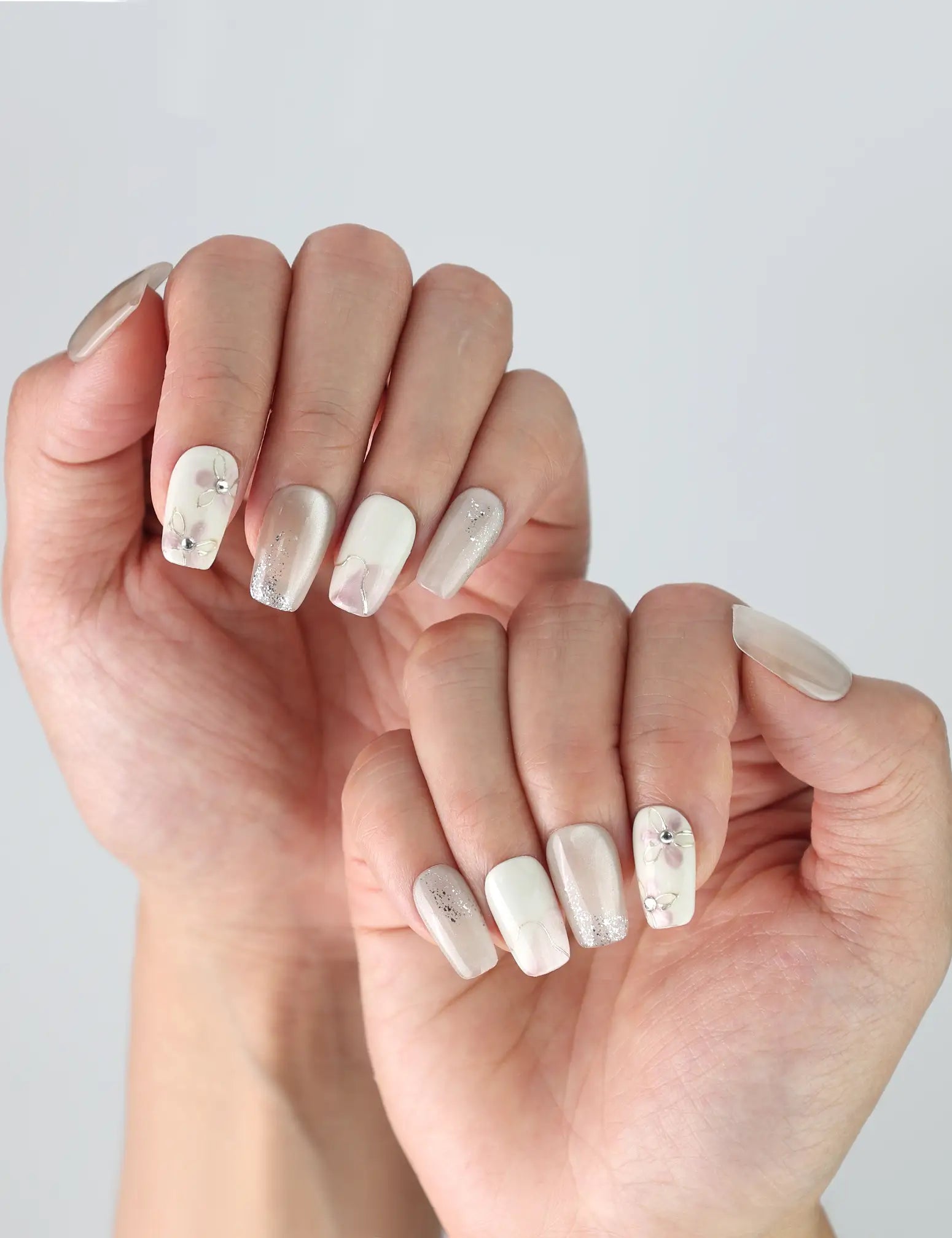 Natural pose showing Naillover Flora Sheen nails with delicate floral gradient, perfect for a clean and simple everyday look.