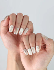 Natural pose showing Naillover Flora Sheen nails with delicate floral gradient, perfect for a clean and simple everyday look.
