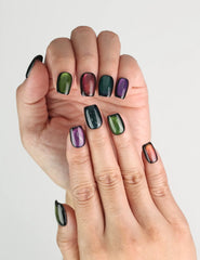 Fingers styled with Galaxy Velvet black cat eye handmade press on nails from Singapore by Naillover, amethyst shimmer