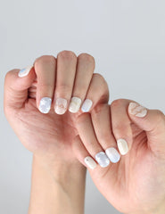 Hand posed with Gentle Echo nails by Naillover, highlighting handmade pastel style and delicate blooms.