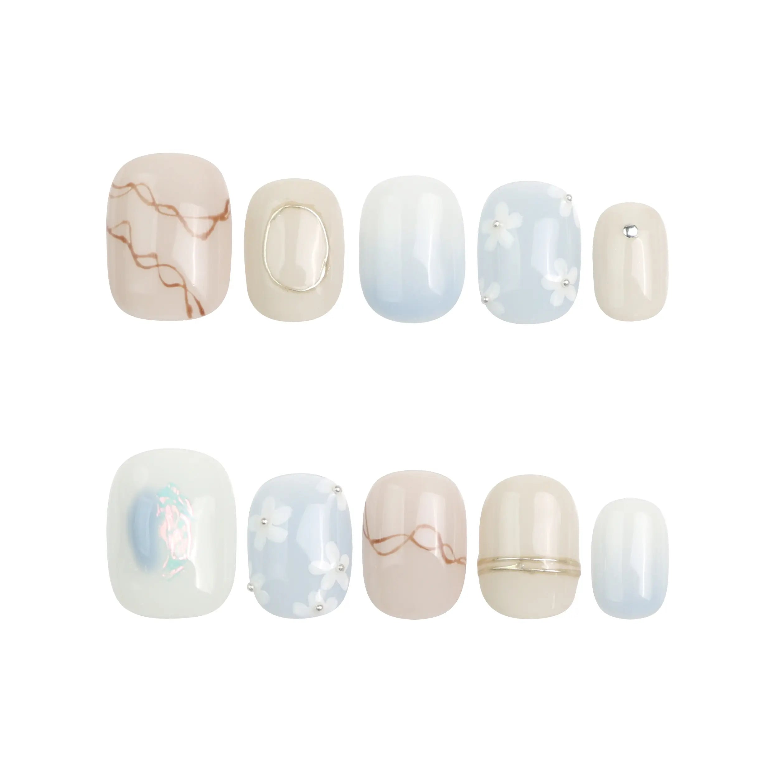 Gentle Echo press on nails by Naillover laid on white background, pastel shades and handmade floral design visible.