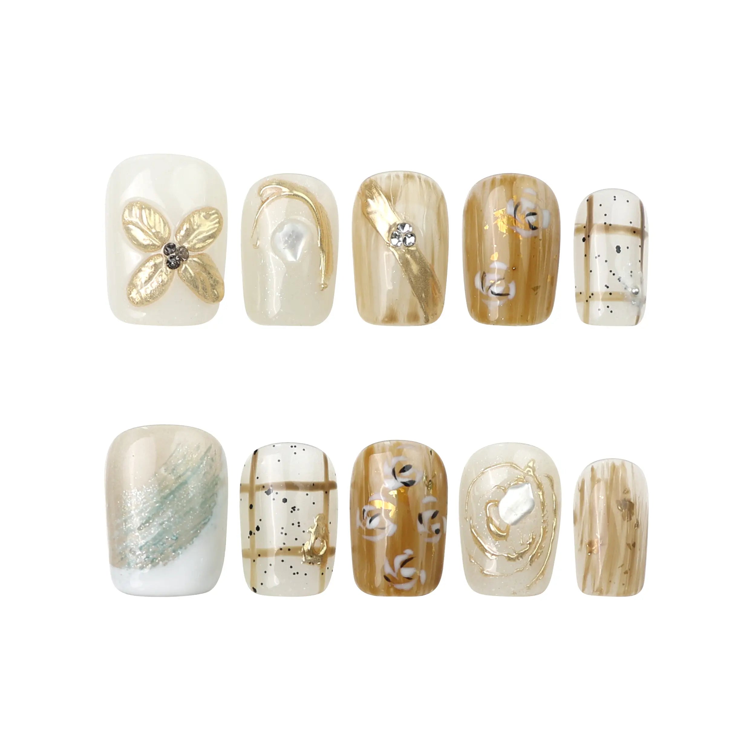 Flat-lay of Gilded Grace press on nails by Naillover—3D beige floral design with golden details on white background.