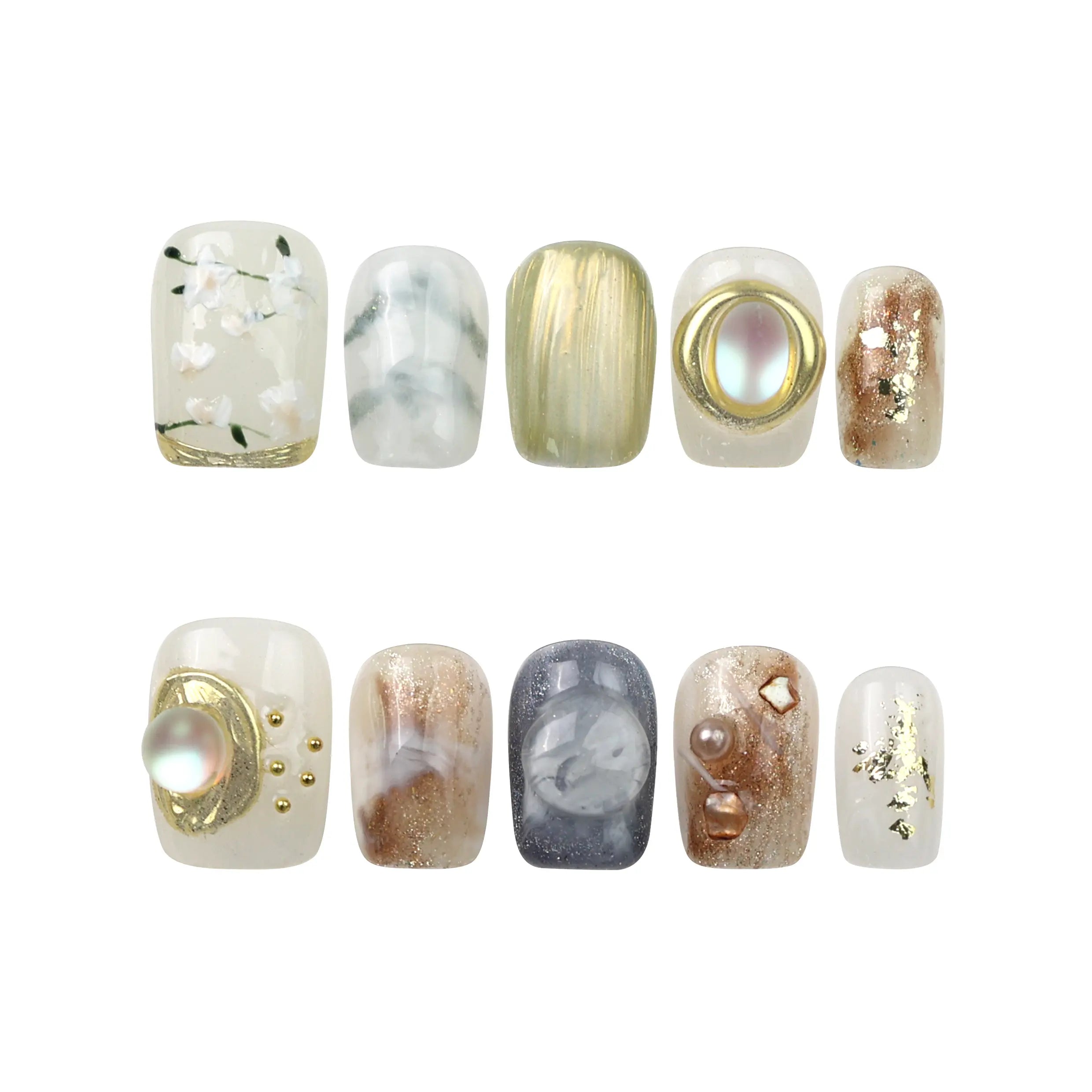 Flat-lay of Naillover handmade Gold Leaf Whisper press on nails—floral and gemstone design from the Singapore press on nails series.