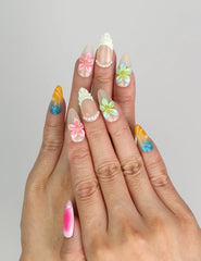 Naillover Gradient Fantasy handmade press on nails Singapore, worn on hand with colorful gradients and 3D flowers.