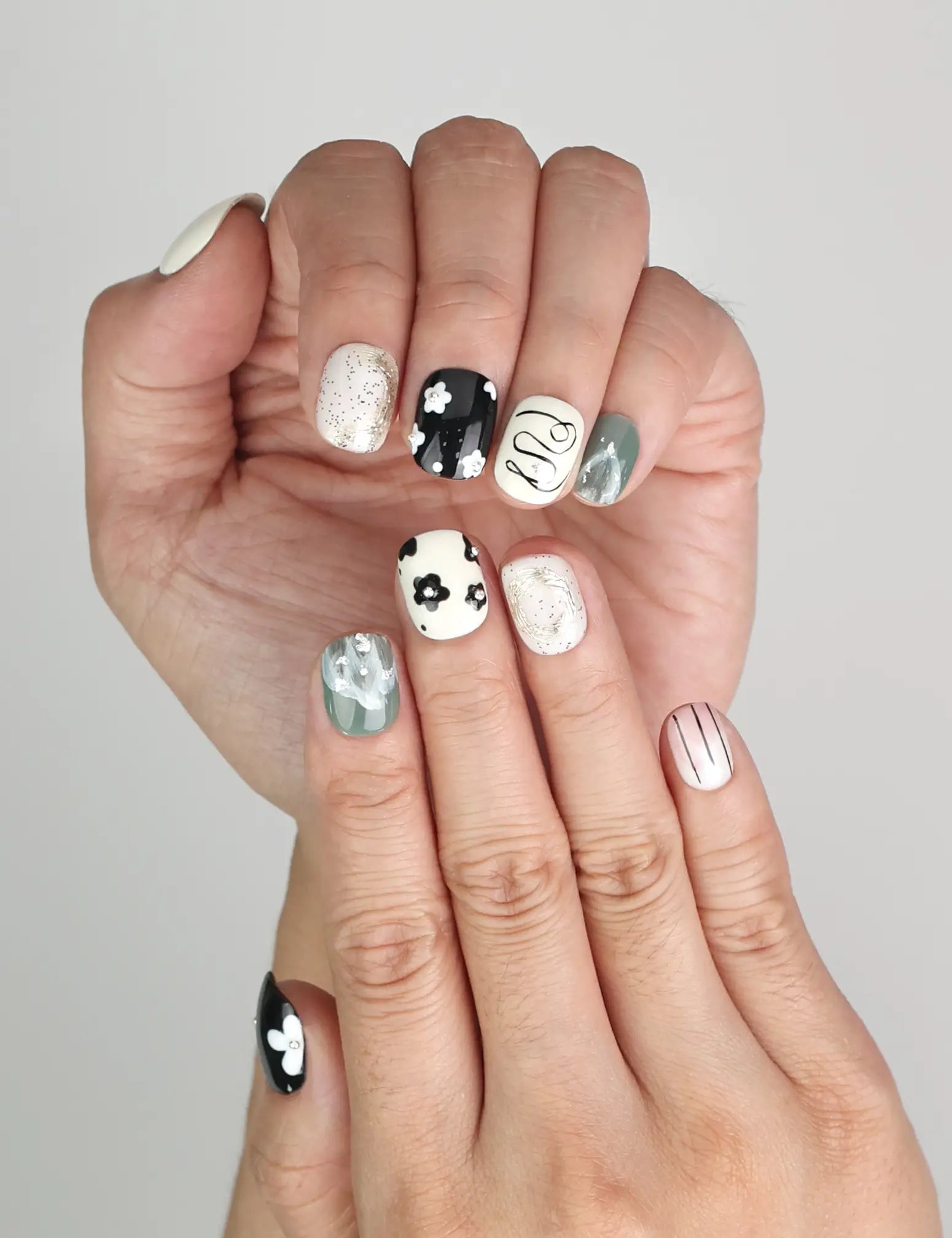 Close-up of Naillover Inky Blossoms Singapore press on nails showing abstract nail art and flower design.