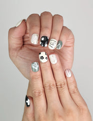 Close-up of Naillover Inky Blossoms Singapore press on nails showing abstract nail art and flower design.