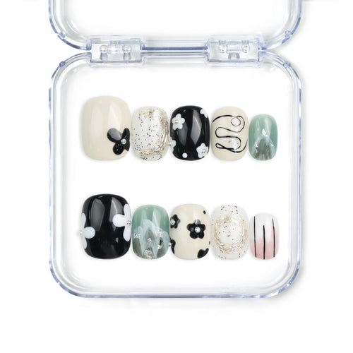 Naillover Inky Blossoms handmade press on nails Singapore in black, white, and green with floral and abstract nail art design.
