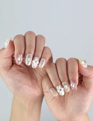 Elegant fingers adorned with Naillover’s Lace Flower press on nails—3D flowers in soft pastel hues perfect for weddings or spring events.