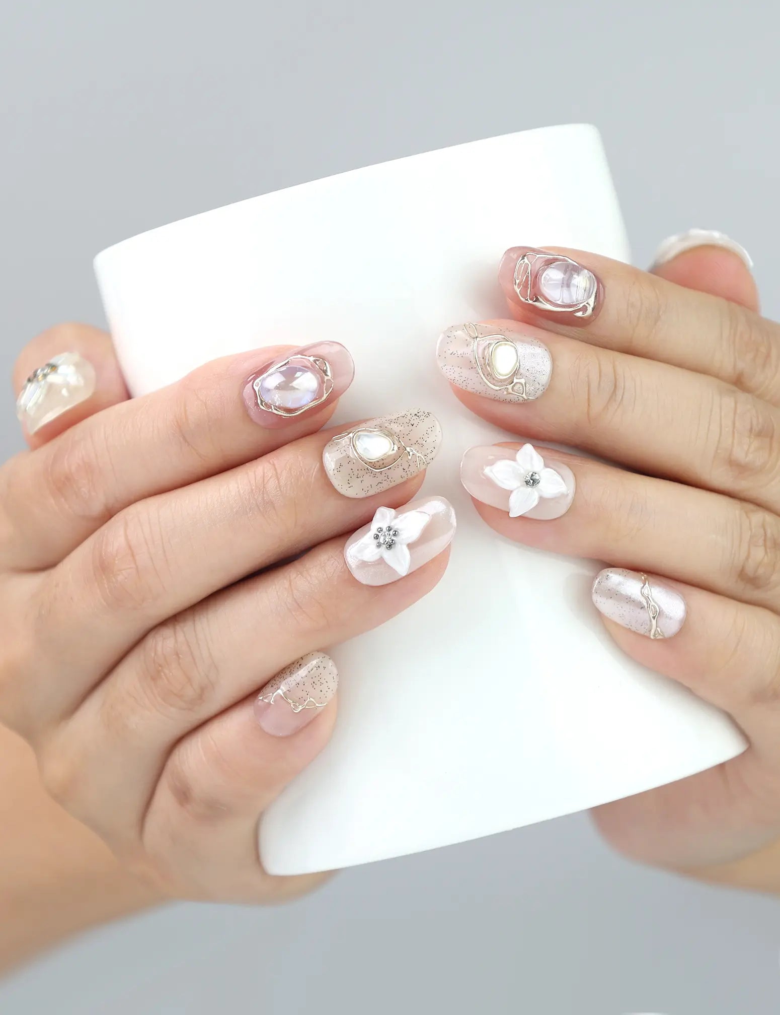 Naillover Lace Flower handmade press on nails shown holding a glass—3D floral nails in pink and white for soft feminine flair.