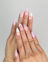 Hand wearing Naillover Lavender Bloom 3D summer nails with floral pink and gold accents