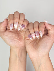 Romantic Naillover Lavender Floral Dream handmade press on nails worn on hand with floral and pearl accents.