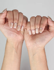 Elegant look of Naillover Lucent Blooms handmade Singapore press on nails in soft pastel hues on model’s hand.