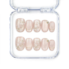 Naillover Lucid Petals handmade Singapore press on nails in soft pink with gold floral motifs and pearls.