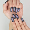Close-up of Lunar Eclipse handmade press on nails, trendy black and purple gradient style