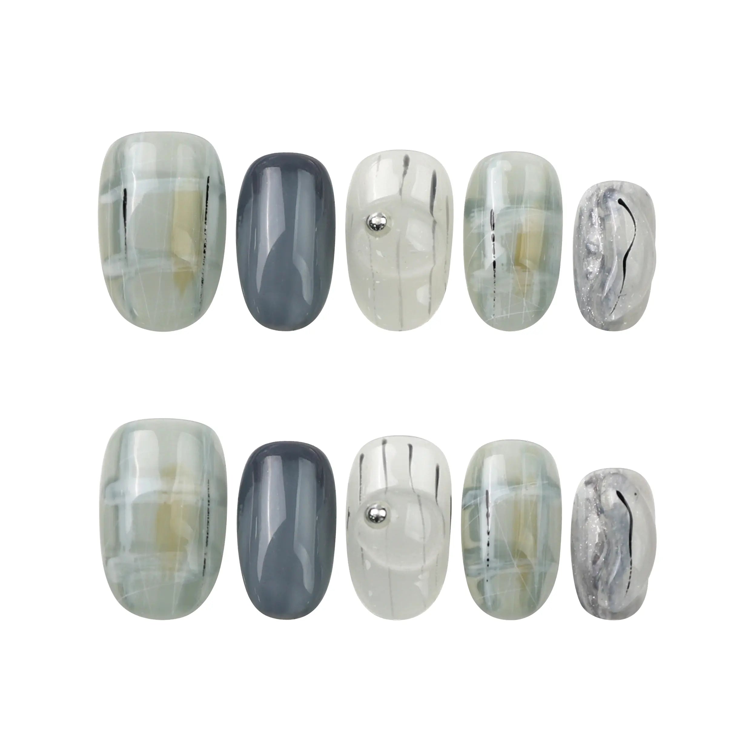 Flat-lay of Naillover Misty Grid handmade press on nails—short square nails with modern grid art in grey and white.