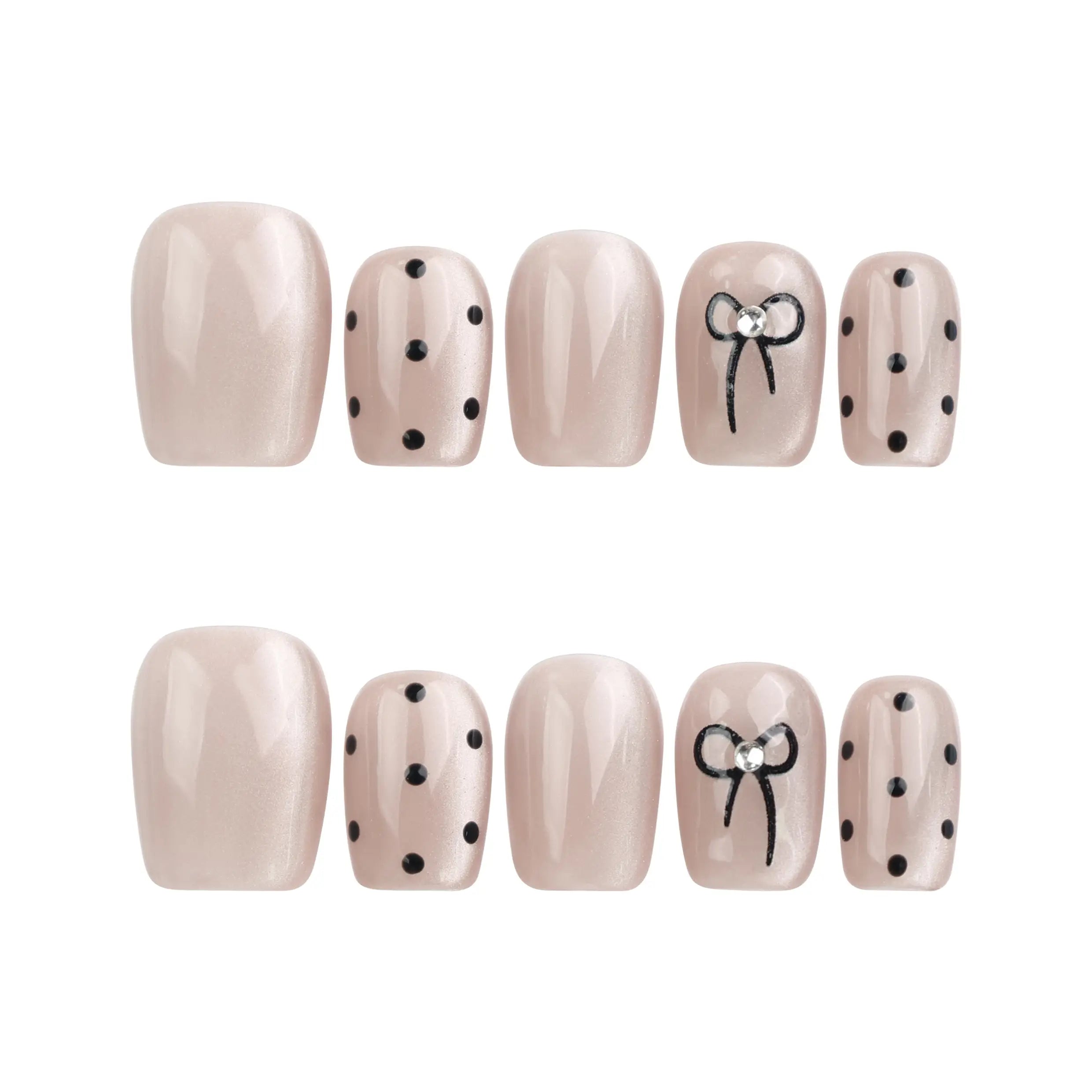 Flat lay of Naillover Mocha Dot handmade press on nails in taupe with polka dots and bows on a clean white background