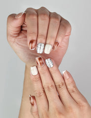 Close-up of Naillover Mocha Matrix trendy handmade press on nails with gold accents and chic patterns.