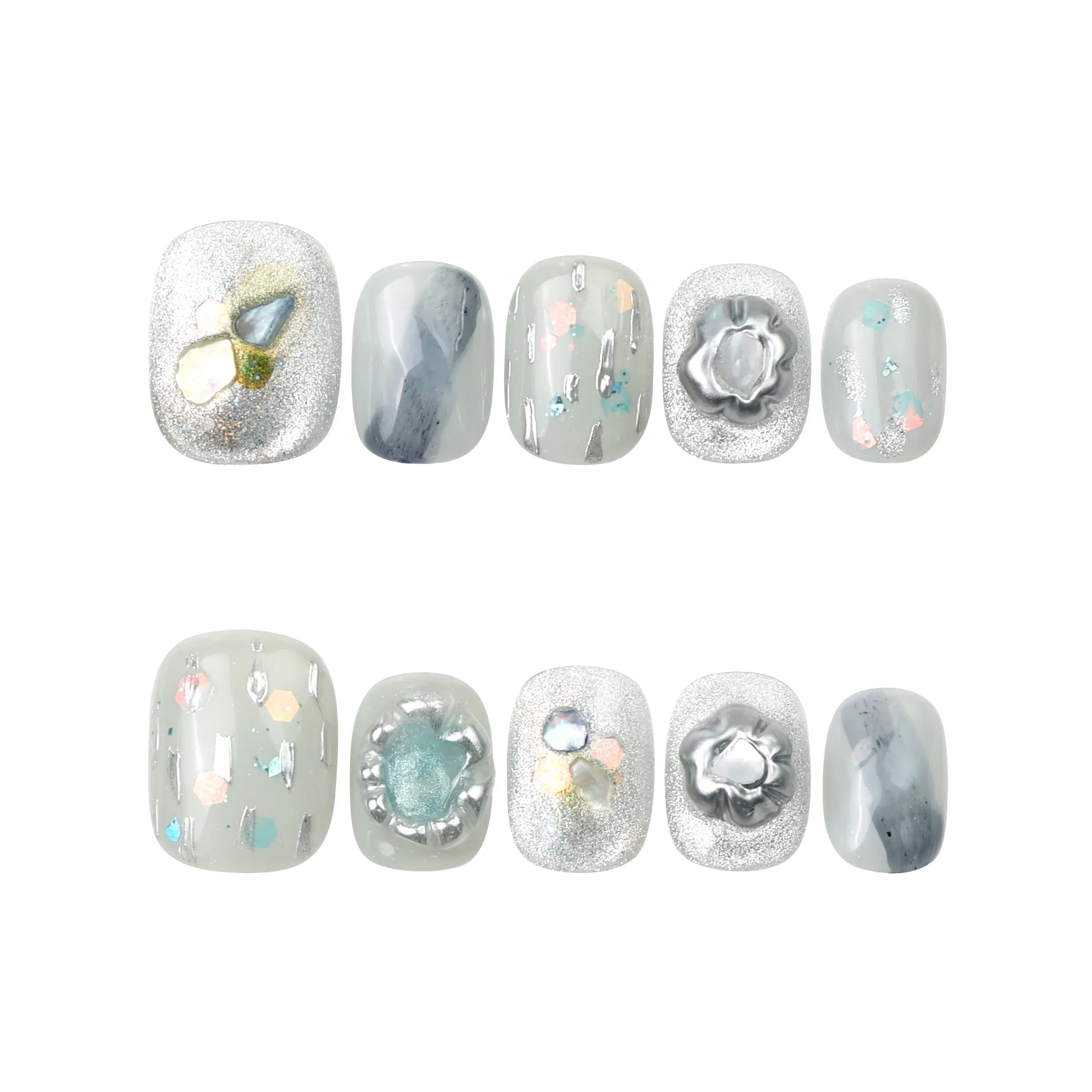 Flat-lay of Naillover Opal Whisper handmade press on nails—smoky grey base with shimmering gold on a white background.