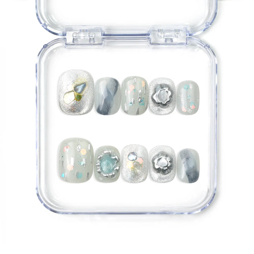 Naillover Opal Whisper handmade short press on nails in smoky grey with gold and pastel detailing from the Singapore press on nails collection.