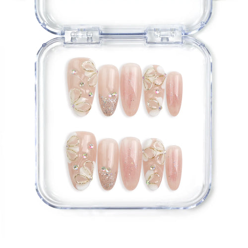 Naillover Peachy Glow Singapore press on nails with soft pink floral accents and a glossy handmade finish.