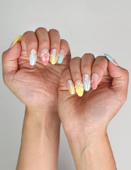 Naillover Pearl Bloom Fantasy press on nails Singapore styled with summer outfit, highlighting trendy nail art.