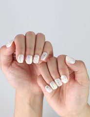 Close-up of Naillover handmade press on nails in Pearl Haze, combining floral elegance and soft shimmer for a graceful look.