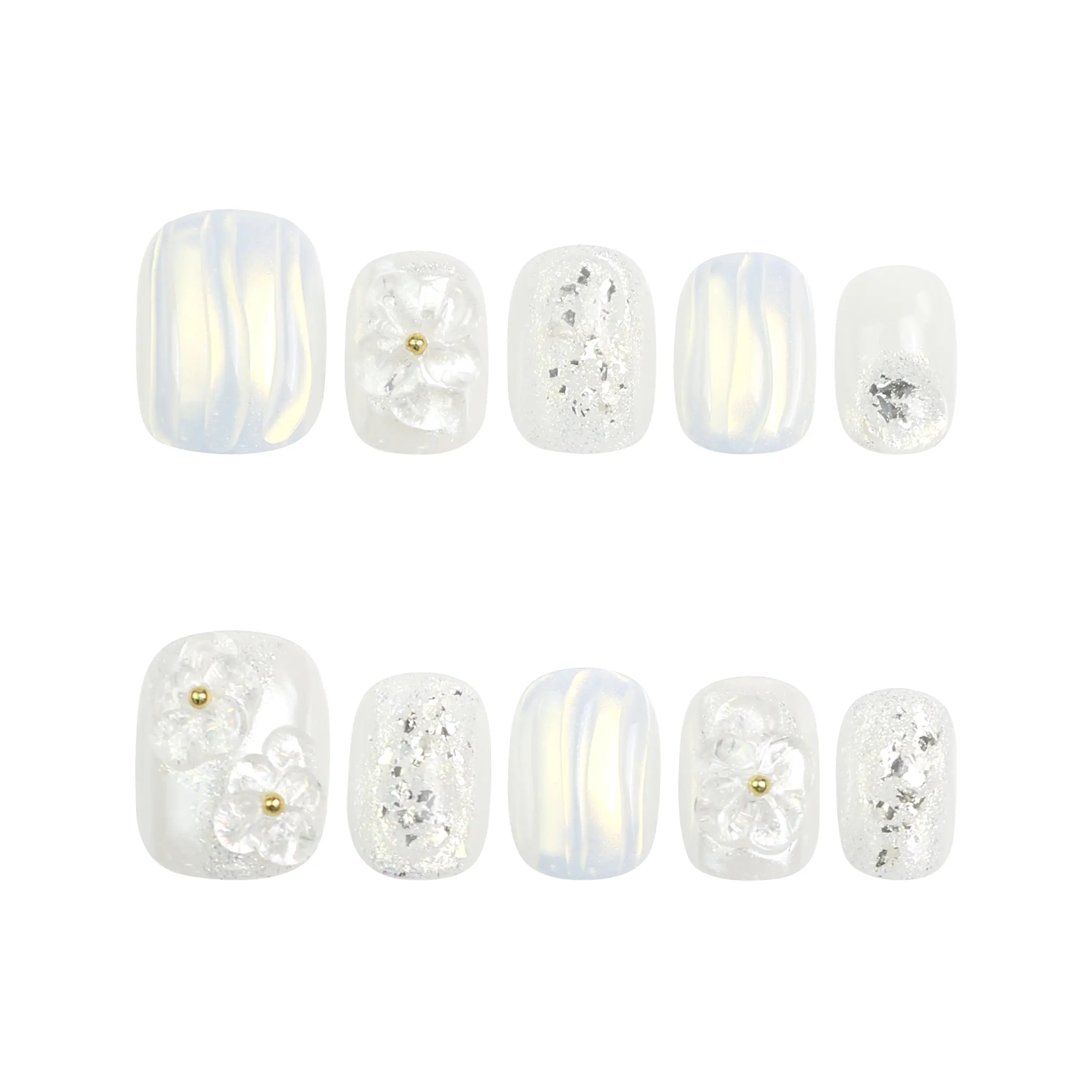 Flat lay of Pearl Haze handmade press on nails on a white background, highlighting 3D flowers, pearls, and translucent texture.