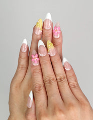 Model wearing Naillover Petal Dream handmade press on nails Singapore with gradient pink and 3D floral accents.