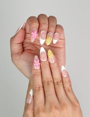 Close-up of Naillover Petal Dream 3D summer nails showing pink gradient base and golden embellishments.