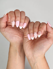Naillover Petal Grace press on nails styled with outfit, highlighting youthful floral nail art.
