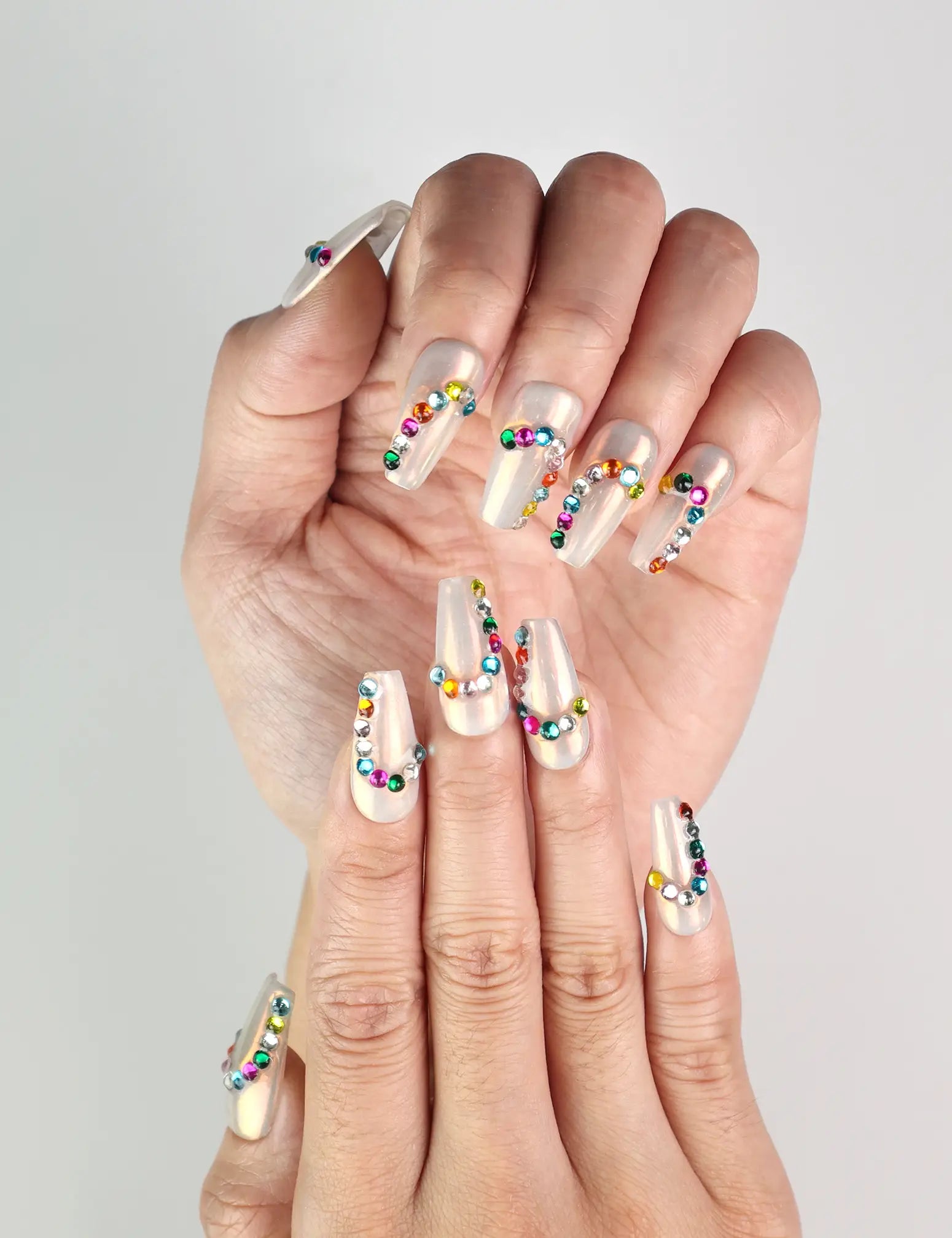 Close-up of Rainbow Arc Singapore press on nails by Naillover with vibrant rainbow design