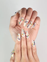 Close-up of Rainbow Arc Singapore press on nails by Naillover with vibrant rainbow design