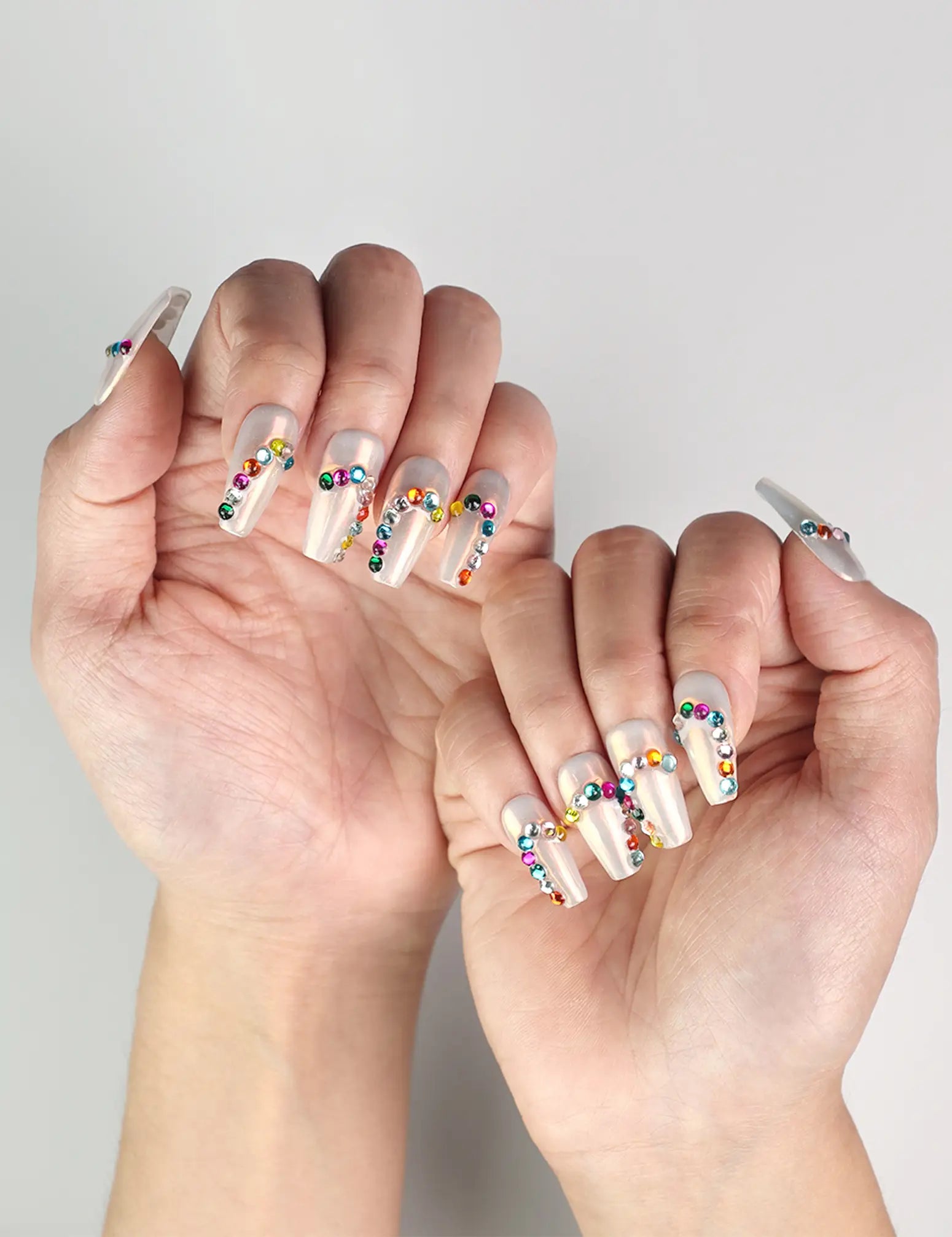 Hand pose with Rainbow Arc handmade Singapore press on nails in colorful, cheerful style