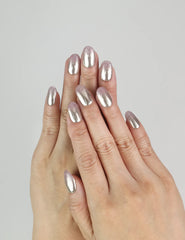 Model wearing Rose Haze Singapore press on nails with soft pink gradient shimmer in elegant coquette style