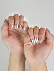 Hand posed to highlight Rose Haze Singapore press on nails with feminine pink gradient and shimmer finish