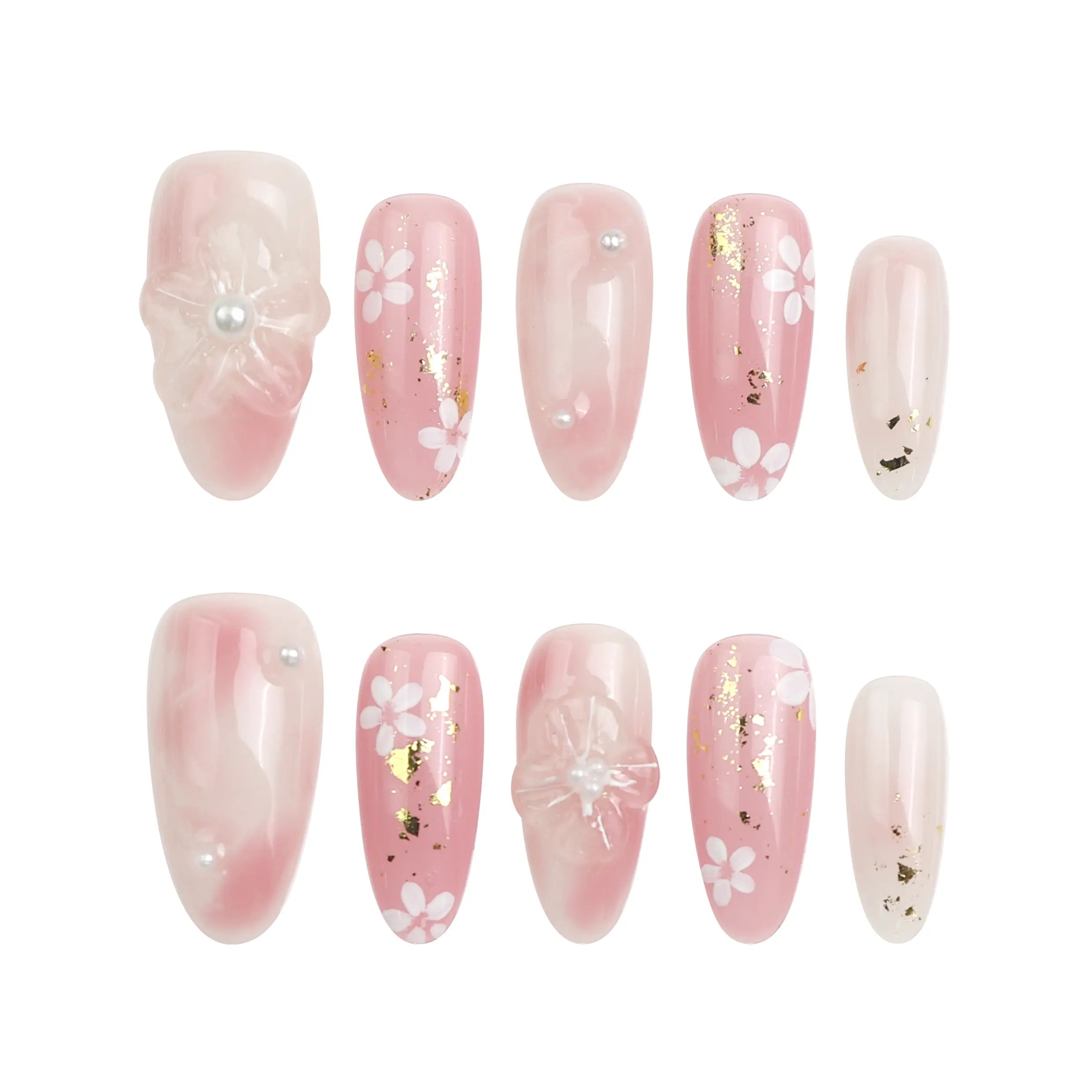 Flat lay of Sakura press on nail set on white background, showcasing pink tones, handcrafted 3D blossoms, and glossy finish.