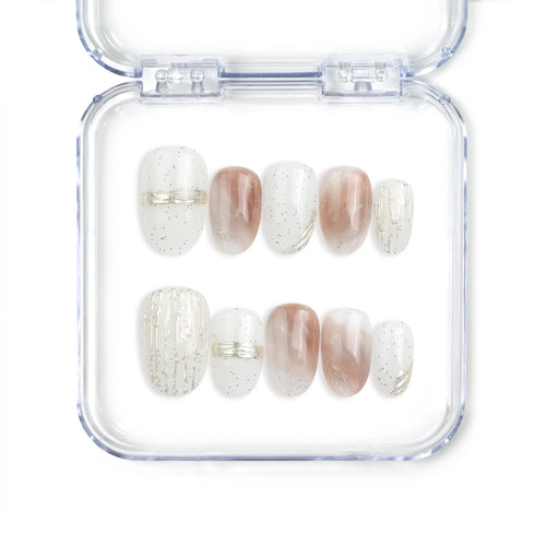 Full set of Naillover Sandy Shine Singapore press on nails featuring a peach and white color blend, handmade speckle details, and soft gold embellishments.