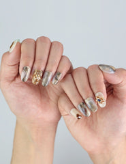 Elegant hand modeling Seashell Gleam press on nails from Naillover’s Singapore collection, highlighting its luxe coquette style.