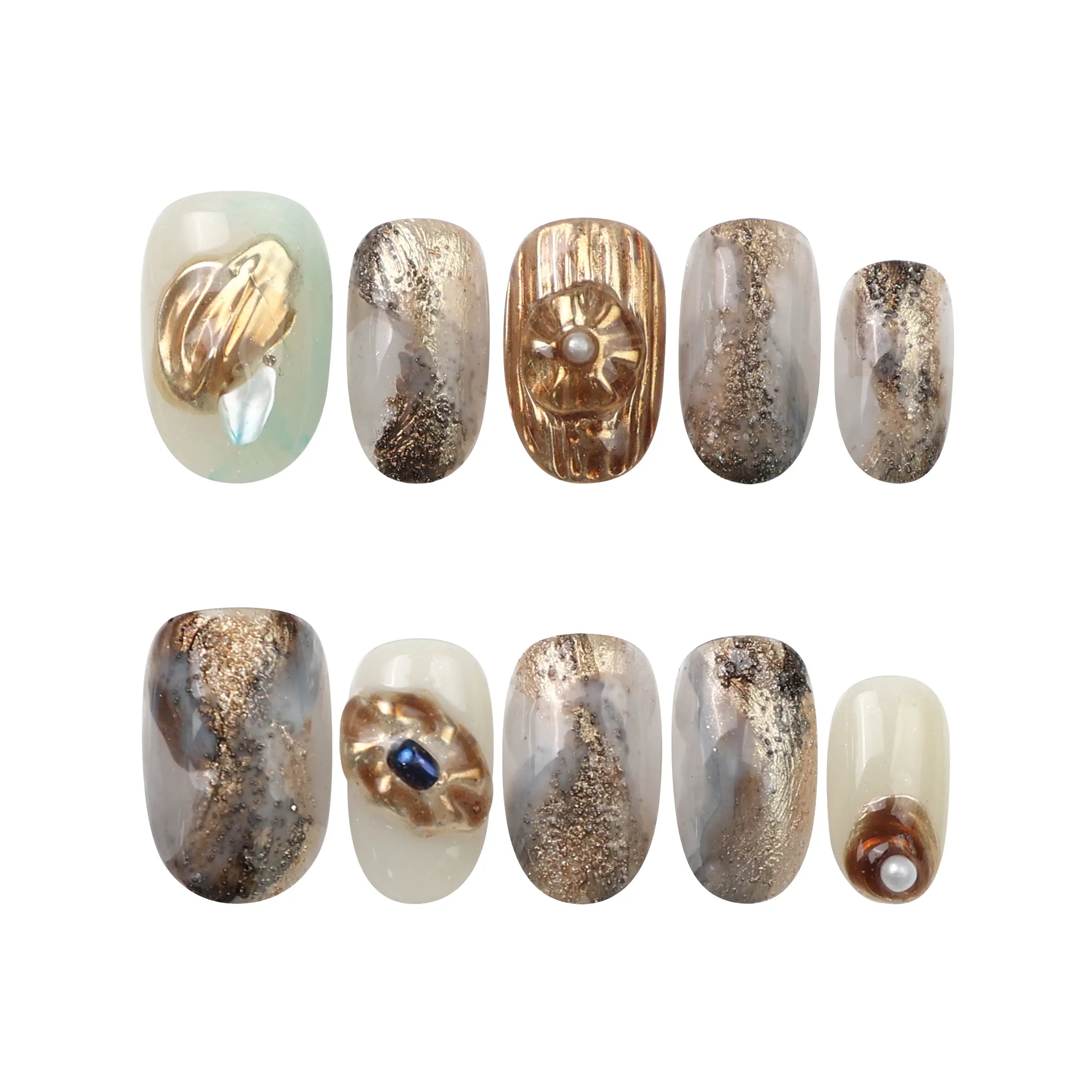 Flat lay of Seashell Gleam handmade press on nails by Naillover—featuring creamy white base, gold leaf, and pearl decor.