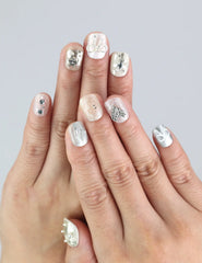Model wearing Naillover Silver Bow nails—short white press on nails with silver bow accents for a chic, classic look.