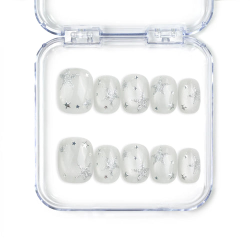 Naillover Silver Skies handmade Singapore press on nails with white base and silver star designs, perfect for trendy glamorous looks.