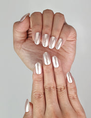 Hand close-up with Naillover Soft Sparkle handmade press on nails, shimmering finish