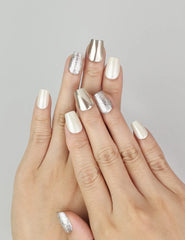 Hand model wearing Naillover Sparkling Cream cat eye Singapore press on nails with pearlescent finish