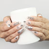 Subtle Knots Singapore press on nails by Naillover with beige base and metallic accents, shown holding a coffee cup