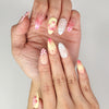Close-up of Naillover handmade Sweet Pink Yellow 3D Floral Droplet nails showing dotted accents and floral art