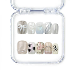 Naillover handmade press on nails in sheer white with frosted lavender tips and crystal accents from Singapore press on nails collection.